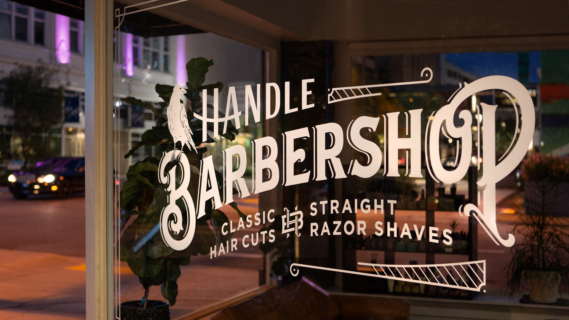 Overview photograph of barbers working at Handle Barbershop in Little Rock, Arkansas